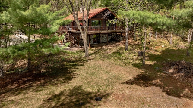 view of yard featuring stairs and a wooden deck