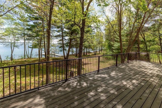 wooden deck featuring a water view