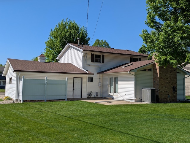 back of house featuring central AC unit, a lawn, and a patio