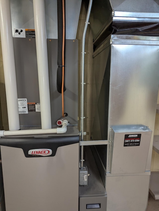 utility room with heating unit