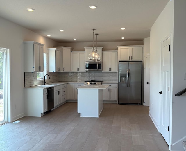 14605 74th St NE, Otsego, MN 55330 - kitchen with appliances with stainless steel finishes, tasteful backsplash, light countertops, and recessed lighting