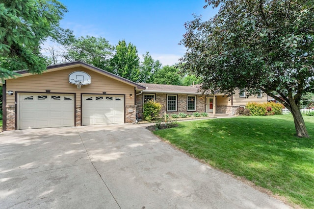 331 Sunset Ln N, Cambridge, MN 55008 - view of front of home featuring a garage, concrete driveway, a front lawn, brick siding, and a shingled roof