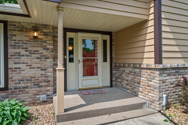 331 Sunset Ln N, Cambridge, MN 55008 - view of exterior entry with brick siding and covered porch