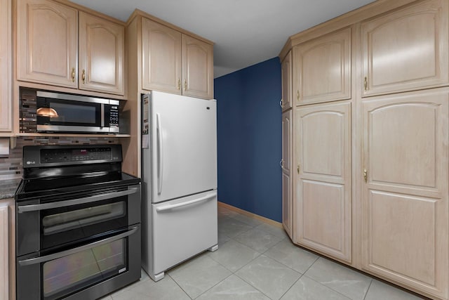 331 Sunset Ln N, Cambridge, MN 55008 - kitchen with appliances with stainless steel finishes, light brown cabinets, and light tile patterned flooring