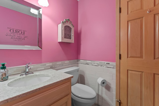 331 Sunset Ln N, Cambridge, MN 55008 - half bath featuring tile walls, vanity, and wainscoting