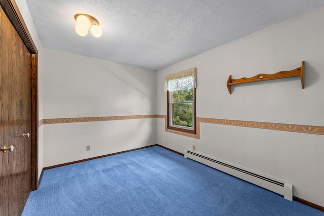 331 Sunset Ln N, Cambridge, MN 55008 - carpeted empty room with baseboard heating and a textured ceiling