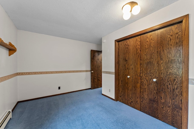 331 Sunset Ln N, Cambridge, MN 55008 - unfurnished bedroom featuring a baseboard heating unit, carpet flooring, a closet, and a textured ceiling