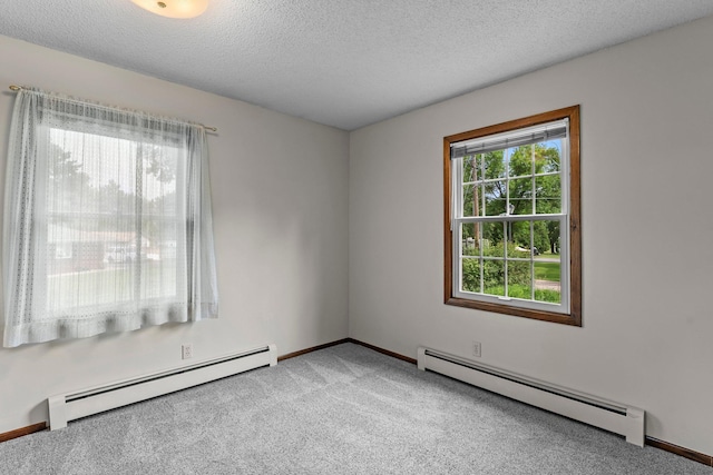 331 Sunset Ln N, Cambridge, MN 55008 - empty room featuring a baseboard radiator, carpet, and a textured ceiling