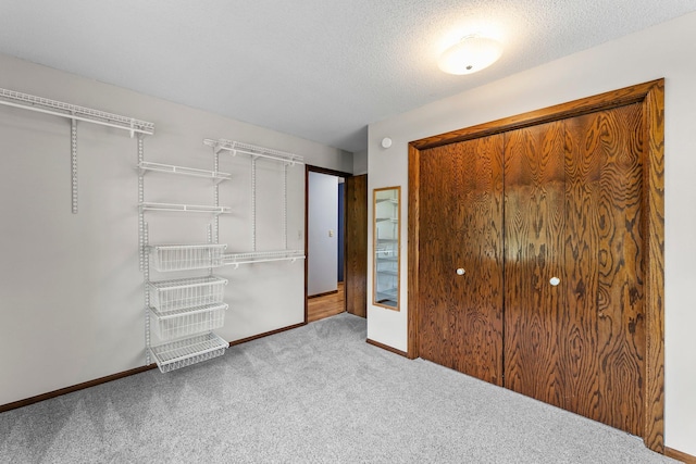 331 Sunset Ln N, Cambridge, MN 55008 - unfurnished bedroom featuring carpet flooring, a closet, and a textured ceiling