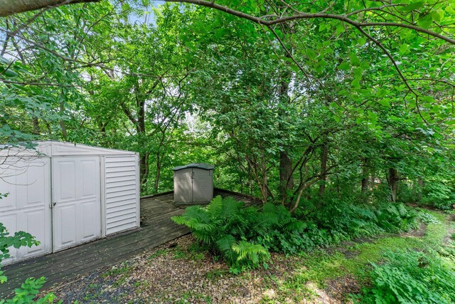 331 Sunset Ln N, Cambridge, MN 55008 - view of yard featuring a shed and a wooden deck