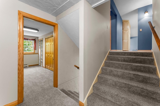 331 Sunset Ln N, Cambridge, MN 55008 - staircase with carpet flooring and a baseboard heating unit
