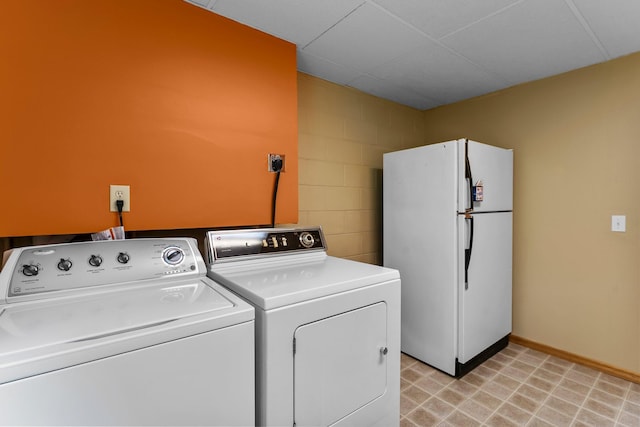 331 Sunset Ln N, Cambridge, MN 55008 - washroom with washing machine and clothes dryer and concrete block wall