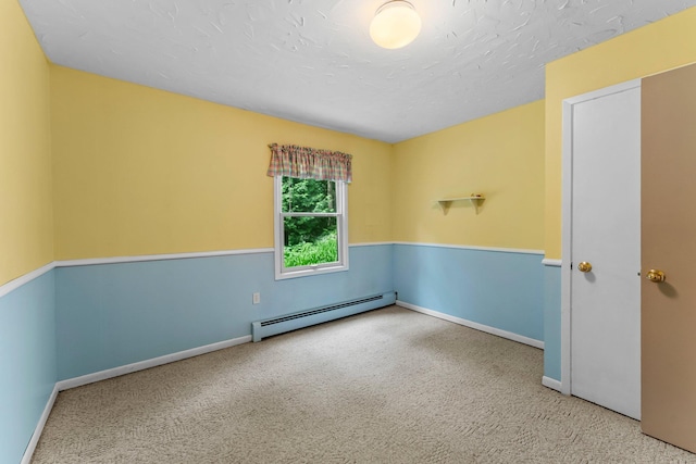 331 Sunset Ln N, Cambridge, MN 55008 - spare room with a baseboard heating unit and carpet