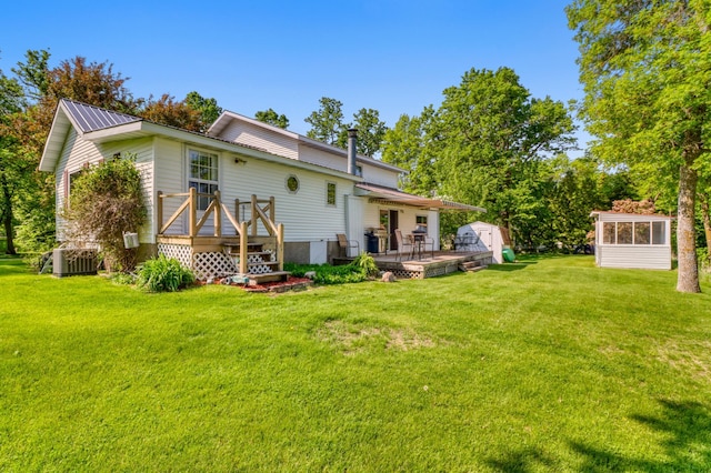 20473 Leisure Dr, Pelican Rapids, MN 56572 - back of house with a wooden deck, a yard, and metal roof