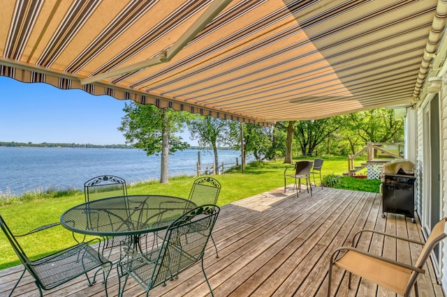 20473 Leisure Dr, Pelican Rapids, MN 56572 - wooden deck with a water view, outdoor dining area, a lawn, and grilling area