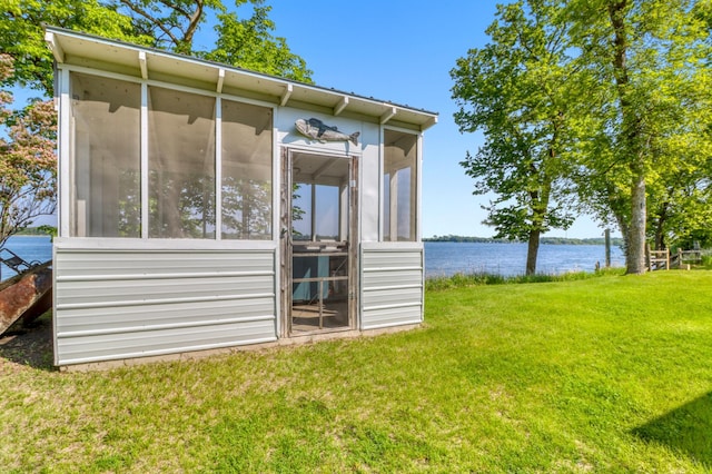 20473 Leisure Dr, Pelican Rapids, MN 56572 - view of side of property featuring a water view, a yard, and a sunroom