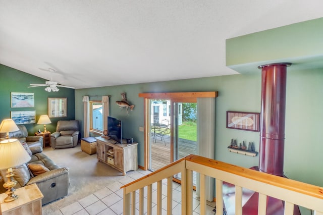 20473 Leisure Dr, Pelican Rapids, MN 56572 - living area featuring lofted ceiling, light tile patterned flooring, light colored carpet, and a ceiling fan