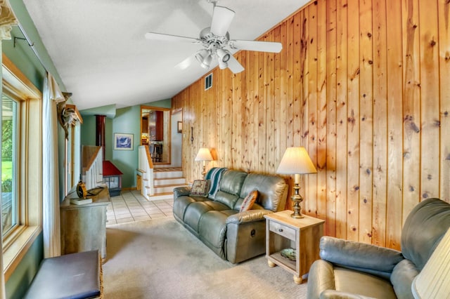 20473 Leisure Dr, Pelican Rapids, MN 56572 - carpeted living room featuring wood walls, stairs, and ceiling fan