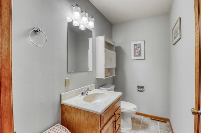 20473 Leisure Dr, Pelican Rapids, MN 56572 - bathroom featuring toilet, vanity, tile patterned flooring, and baseboards