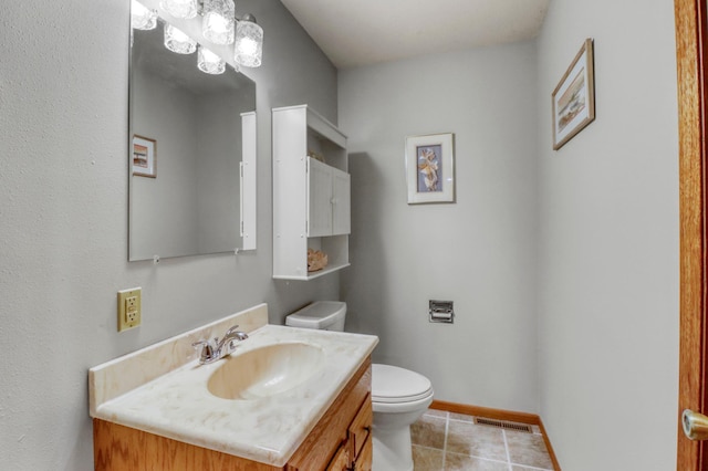 20473 Leisure Dr, Pelican Rapids, MN 56572 - bathroom featuring vanity, toilet, tile patterned flooring, and baseboards