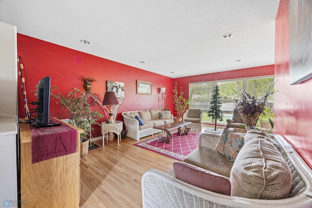 2020 5th St S, Moorhead, MN 56560 - living room with wood finished floors, an accent wall, and recessed lighting
