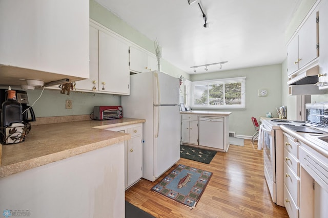 2020 5th St S, Moorhead, MN 56560 - kitchen with white appliances, under cabinet range hood, rail lighting, white cabinetry, and light countertops