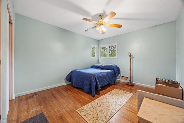 2020 5th St S, Moorhead, MN 56560 - bedroom with baseboards, wood finished floors, and ceiling fan
