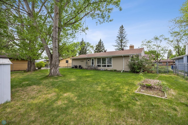 2020 5th St S, Moorhead, MN 56560 - rear view of house with a chimney
