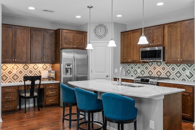 12266 Midway Cir NE, Blaine, MN 55449 - kitchen featuring appliances with stainless steel finishes, a sink, decorative backsplash, dark wood-style floors, and recessed lighting
