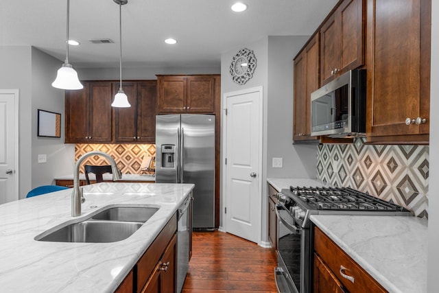 12266 Midway Cir NE, Blaine, MN 55449 - kitchen with stainless steel appliances, a sink, dark wood finished floors, backsplash, and recessed lighting