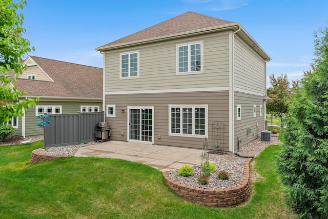 12266 Midway Cir NE, Blaine, MN 55449 - rear view of property with a patio area, central AC, and a yard