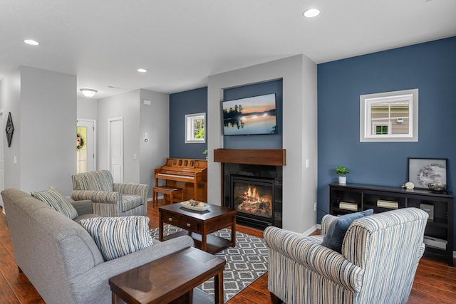 12266 Midway Cir NE, Blaine, MN 55449 - living room with dark wood-style floors, a tile fireplace, recessed lighting, and baseboards