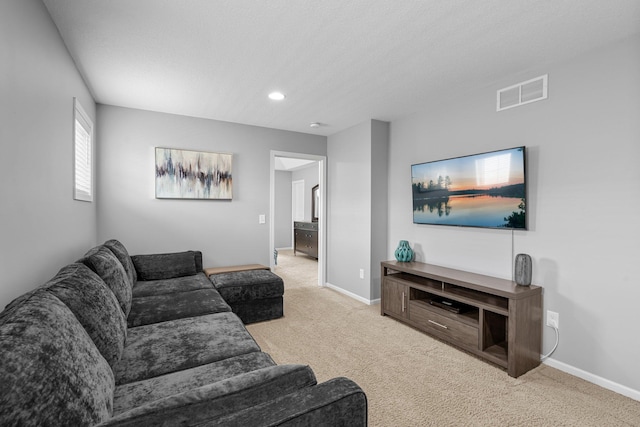 12266 Midway Cir NE, Blaine, MN 55449 - carpeted living room with baseboards and recessed lighting