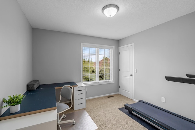 12266 Midway Cir NE, Blaine, MN 55449 - carpeted home office with a textured ceiling and baseboards