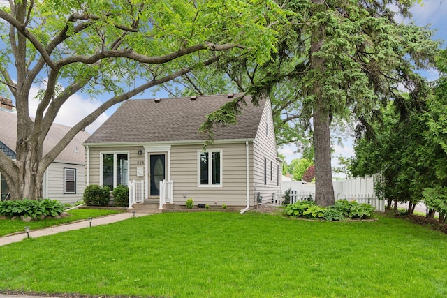 426 14th Ave N, Hopkins, MN 55343 - cape cod-style house featuring roof with shingles