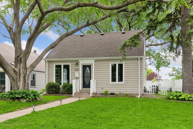 426 14th Ave N, Hopkins, MN 55343 - cape cod-style house featuring roof with shingles