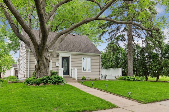 426 14th Ave N, Hopkins, MN 55343 - view of front of home featuring a shingled roof