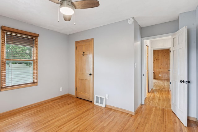 426 14th Ave N, Hopkins, MN 55343 - unfurnished bedroom with light wood-type flooring, baseboards, and a ceiling fan