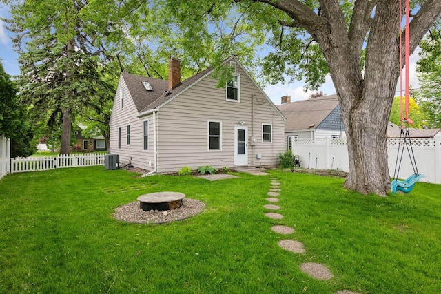 426 14th Ave N, Hopkins, MN 55343 - rear view of property with central air condition unit, a chimney, and roof with shingles