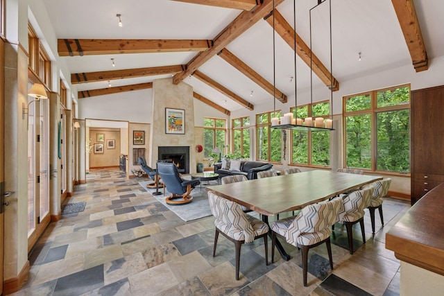 20545 Linden Rd, Deephaven, MN 55331 - dining space featuring a fireplace, high vaulted ceiling, beam ceiling, and stone finish floors