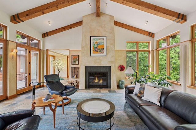 20545 Linden Rd, Deephaven, MN 55331 - living area featuring high vaulted ceiling, beamed ceiling, stone finish floors, and a fireplace