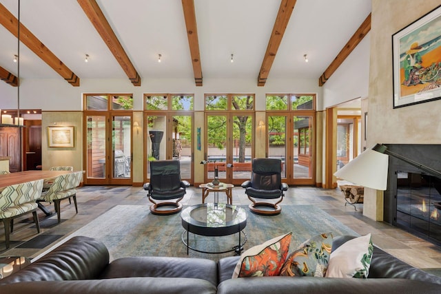 20545 Linden Rd, Deephaven, MN 55331 - living room featuring stone tile floors, french doors, beam ceiling, and a fireplace with flush hearth