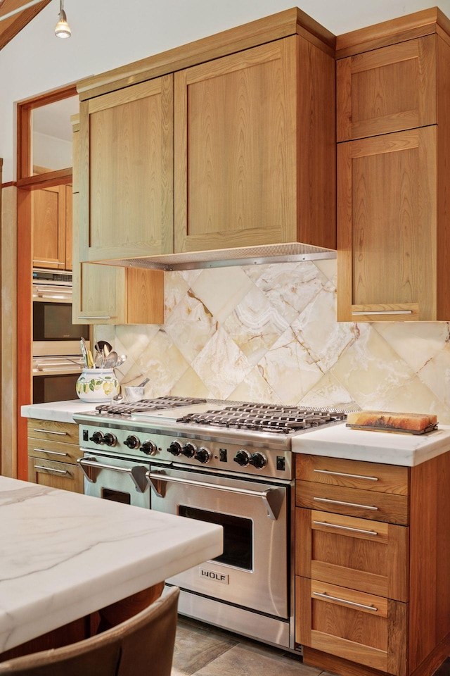 20545 Linden Rd, Deephaven, MN 55331 - kitchen featuring luxury stove, tasteful backsplash, and light countertops