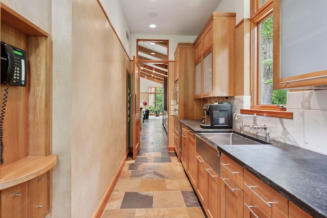 20545 Linden Rd, Deephaven, MN 55331 - kitchen featuring healthy amount of natural light, light stone finish floors, backsplash, and recessed lighting