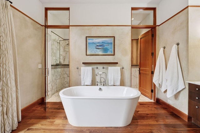 20545 Linden Rd, Deephaven, MN 55331 - full bathroom with a stall shower, vanity, a freestanding bath, and wood finished floors