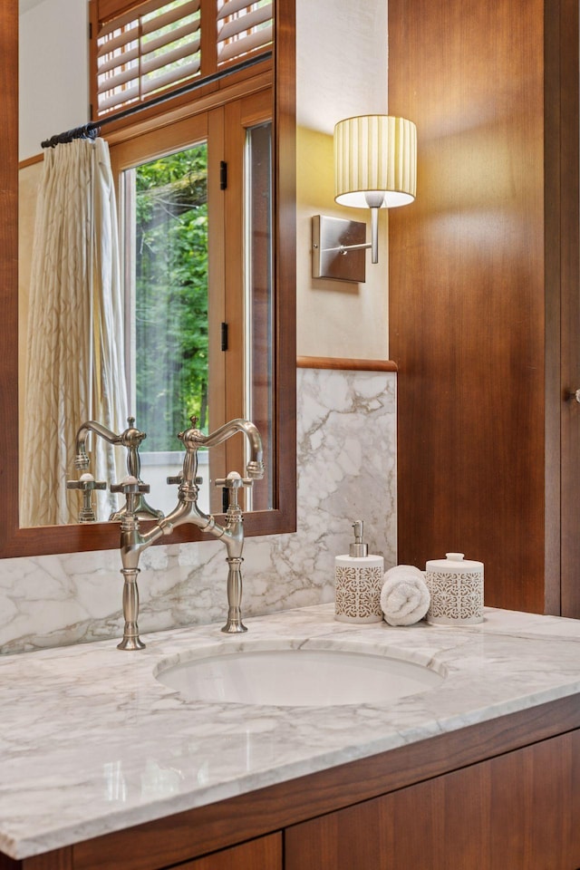 20545 Linden Rd, Deephaven, MN 55331 - bathroom featuring vanity and decorative backsplash