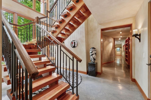 20545 Linden Rd, Deephaven, MN 55331 - staircase with baseboards and finished concrete floors