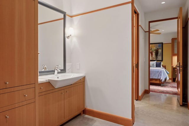 20545 Linden Rd, Deephaven, MN 55331 - bathroom with vanity, baseboards, finished concrete floors, connected bathroom, and recessed lighting