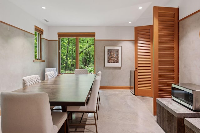 20545 Linden Rd, Deephaven, MN 55331 - dining area with concrete floors, recessed lighting, and baseboards