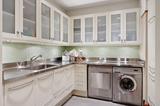 20545 Linden Rd, Deephaven, MN 55331 - laundry room with washing machine and clothes dryer and tile patterned flooring